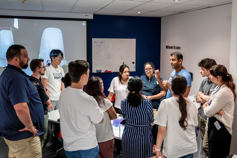 Dentists discussing a clinical demonstration